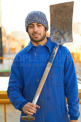 Buy stock photo Portrait, shovel and a man construction worker on a building site for manual labor on a development project. Industrial, builder and maintenance with a professional engineer or contractor outdoor
