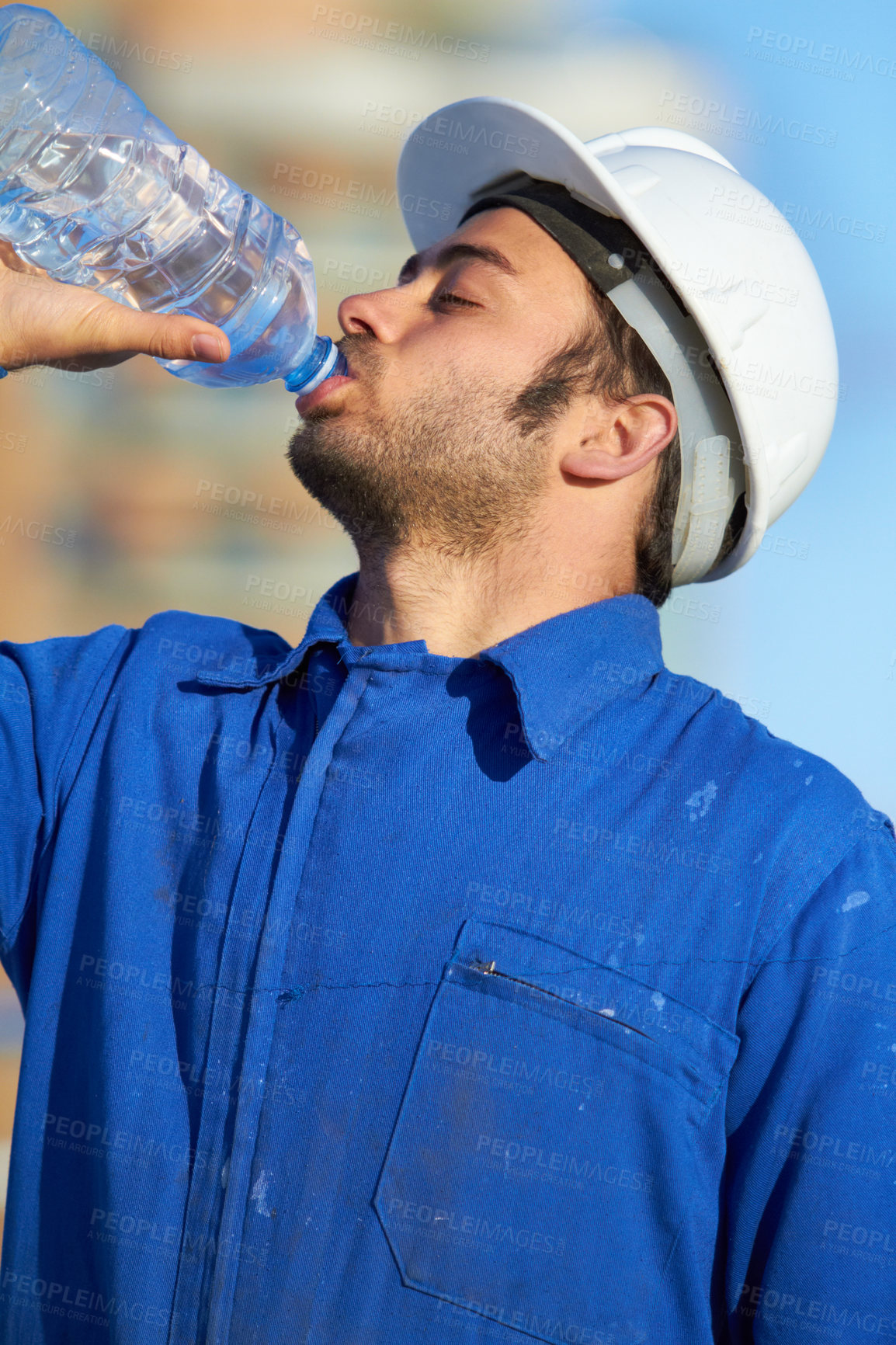 Buy stock photo A construction replenishing lost nutrients after a long day