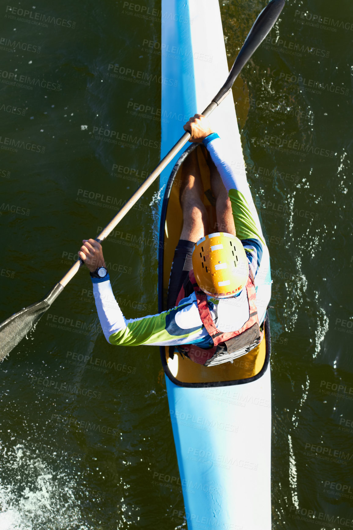 Buy stock photo A high angle shot of a man canoeing down a river