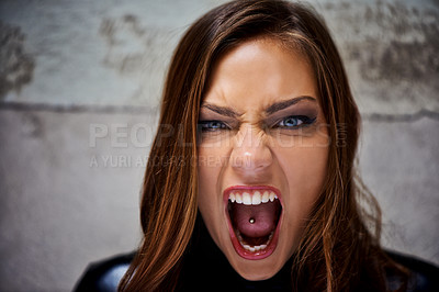 Buy stock photo Beautiful young woman screaming violently while looking at you
