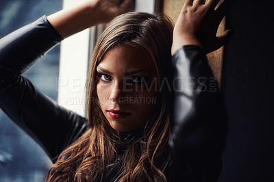 Buy stock photo Portrait, beauty and feminine with a confident woman in the bedroom of her home for fashion or style. Dark, face and natural with a young person alone in her apartment to relax in the evening