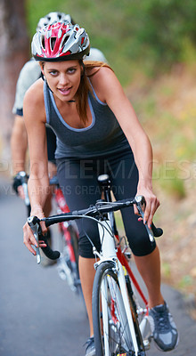 Buy stock photo Cycling, fitness and portrait of woman on a bicycle in road for training, wellness or sports race. Health, exercise or face of lady athlete on a bike for morning cardio, workout or marathon challenge