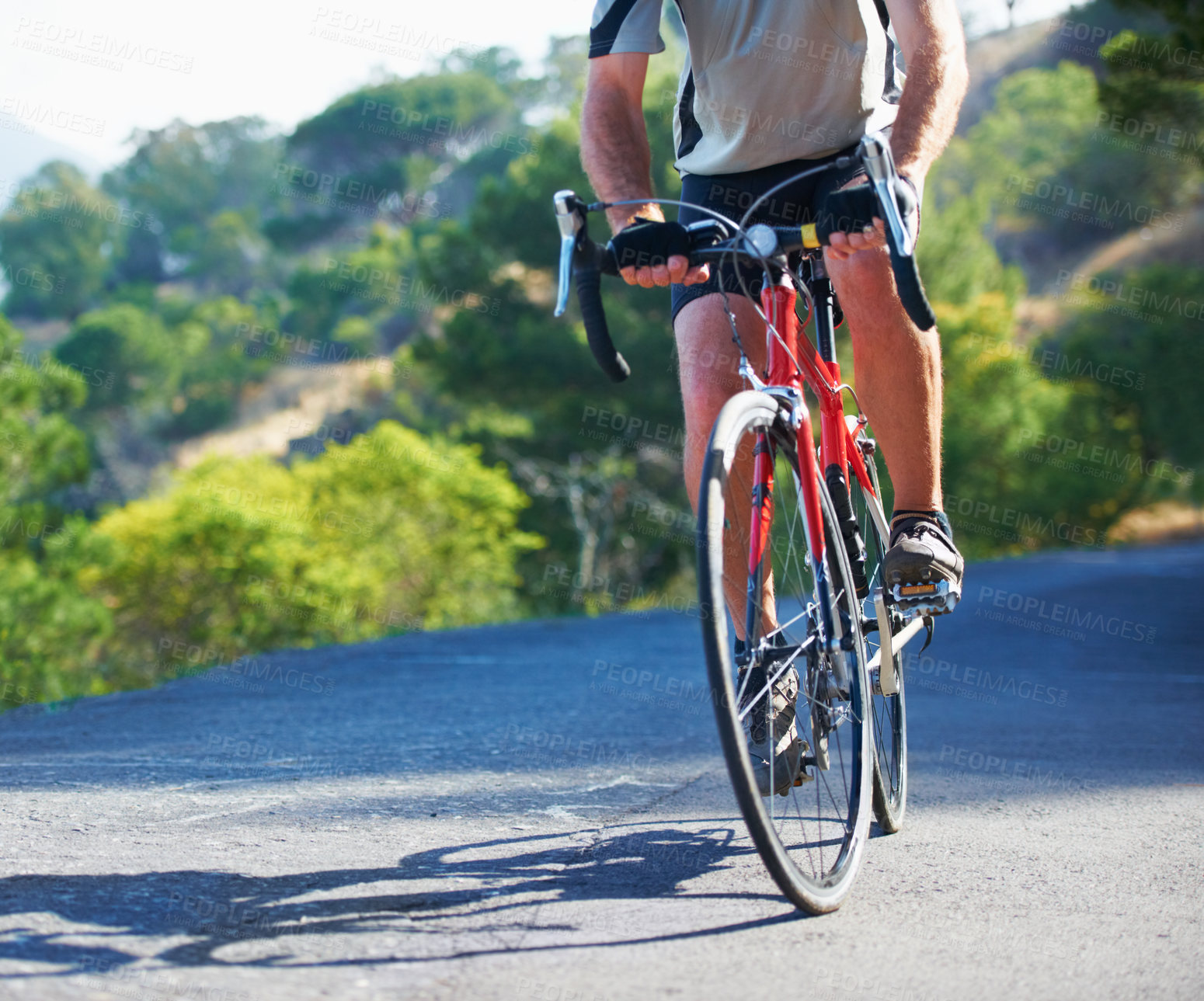 Buy stock photo Cycling, fitness and legs of man on a bicycle in road for training, wellness or sport outdoor. Health, exercise or male athlete on a bike in a street for morning cardio, workout or marathon challenge