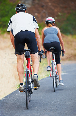 Buy stock photo Back, road and couple cycling in nature for cardio, fitness and training on bicycle together. Outdoor, people and exercise on bike for fun, workout and travel in countryside adventure or journey