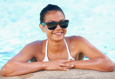 Buy stock photo Woman, swimming pool and smile with summer, sunglasses and tourism to relax in water on vacation. Girl, outdoor and bikini with glasses, freedom and sunshine with fashion on holiday in Indonesia