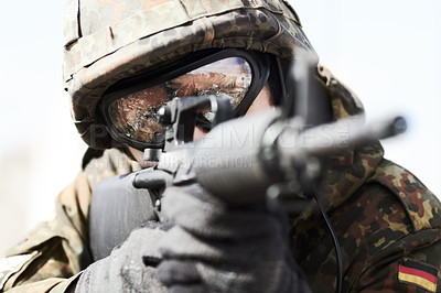 Buy stock photo Close up of a german soldier pointing his gun ready to fire