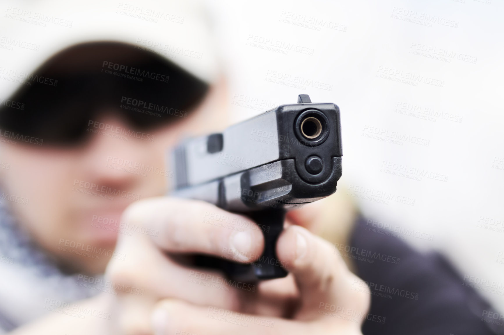Buy stock photo Closeup selective focus of a handgun held by a soldier during a training