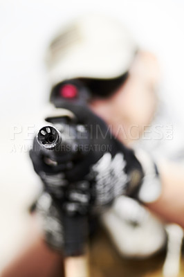 Buy stock photo Closeup selective focus on the barrel of a gun held by a soldier
