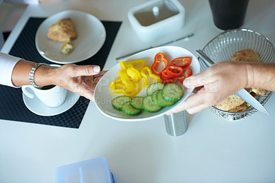 Buy stock photo People, hands and passing salad at breakfast table for vegetables, diet or healthy eating at home. Closeup of person giving plate of natural organic food for nutrition snack or meal together at house