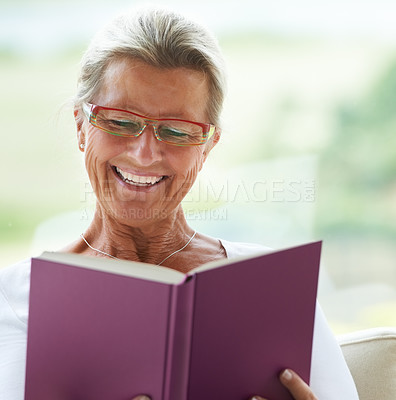 Buy stock photo Happy senior woman, home and book with reading, sofa and relax in living room with story, knowledge and glasses. Elderly lady, person and thinking on lounge couch in retirement with novel in house