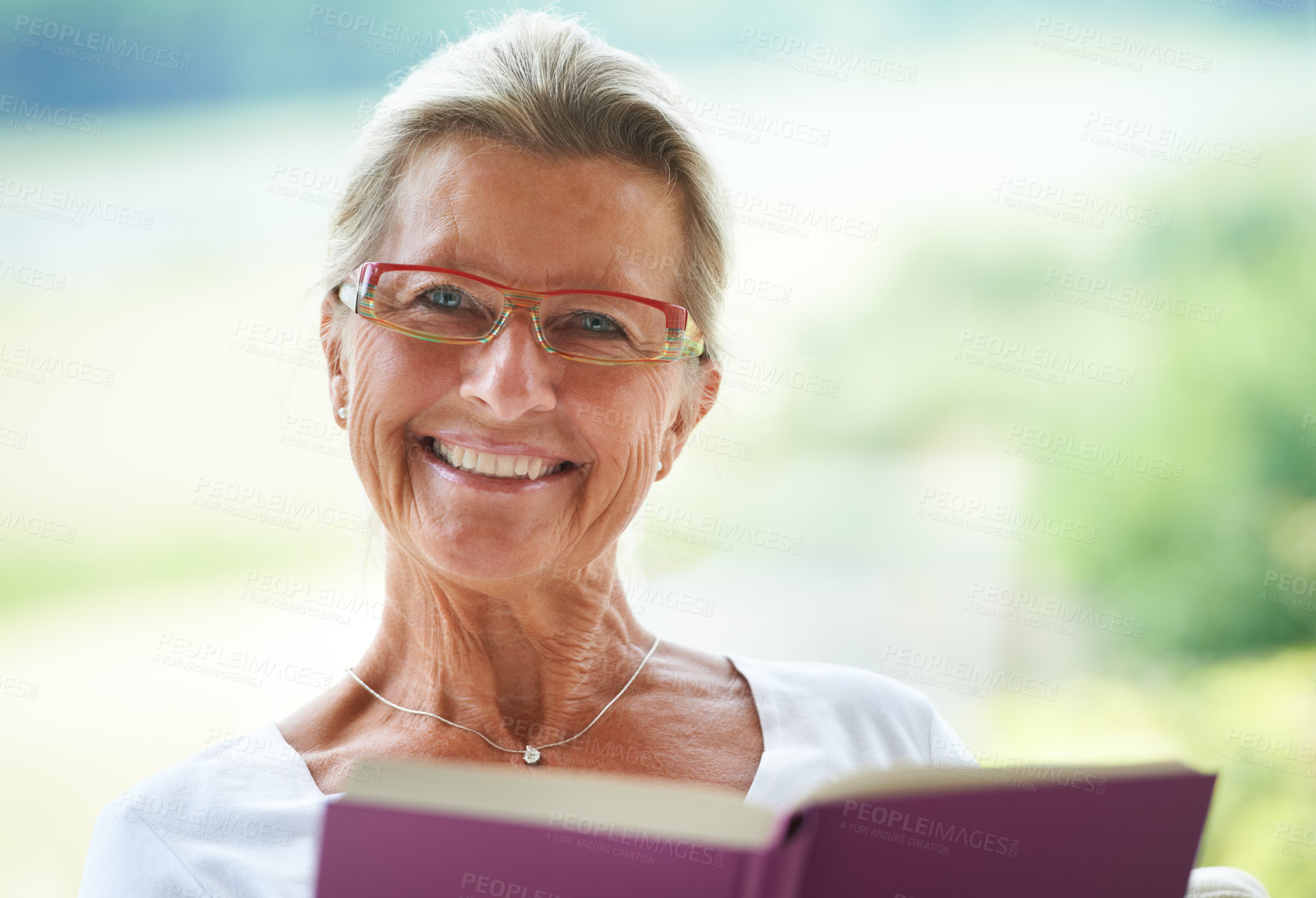 Buy stock photo Senior woman, home and book in portrait for reading, relax and living room with smile for story, knowledge or glasses. Happy elderly lady, person and face in lounge in retirement with novel in house