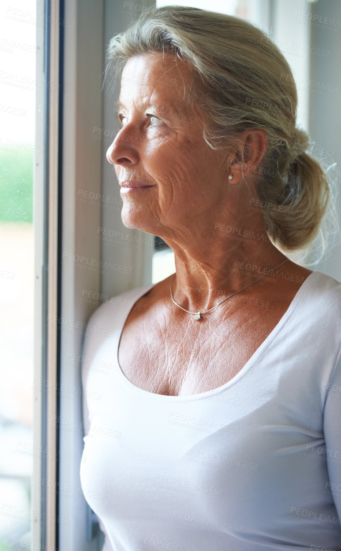 Buy stock photo Senior, woman and thinking of nostalgia in home with smile for fond memory, peace or happiness. Elderly person, looking and window with relaxed expression on face for wellness, care and retirement