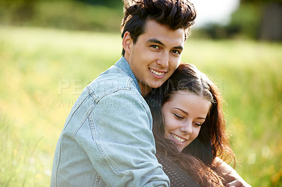 Buy stock photo Field, love and couple relax in nature for romance, summer or valentines celebration with portrait, smile and sunshine. Young people or woman and partner on picnic, grass or countryside date together