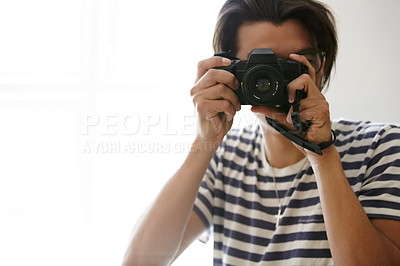 Buy stock photo Man, camera and photographer with vision, creative and art in apartment, pictures and inspiration. Male person, confident and photography or lens, vintage technology and retro equipment or gadget