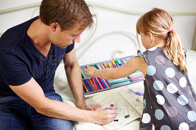 Buy stock photo Dad, daughter and coloring book for homework with helping, bonding and learning for education in bedroom of home. People, man and girl child with homeschooling, creativity and care on bed of house
