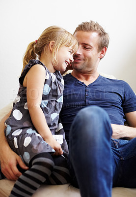 Buy stock photo Dad, girl and laugh with smile, couch and embrace with love, daughter and house. Man, happy and lounge for bonding together for relationship, affection and parent with child, caring and family home

