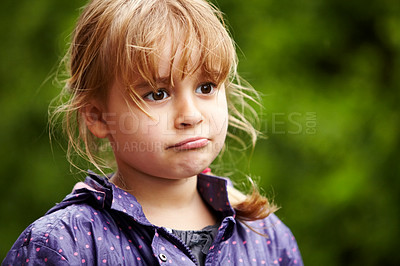 Buy stock photo Girl, child and thinking outdoor with sad, raincoat and decision or choice to play in rain weather. Person, kid and emoji with disappointed expression, annoyed or moody in nature or backyard garden