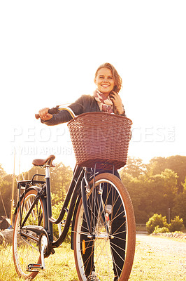 Buy stock photo Countryside, nature and portrait of happy woman with bicycle, adventure or travel in morning. Summer, smile and bike with a basket at sunset and person in sunshine with transportation for cycling