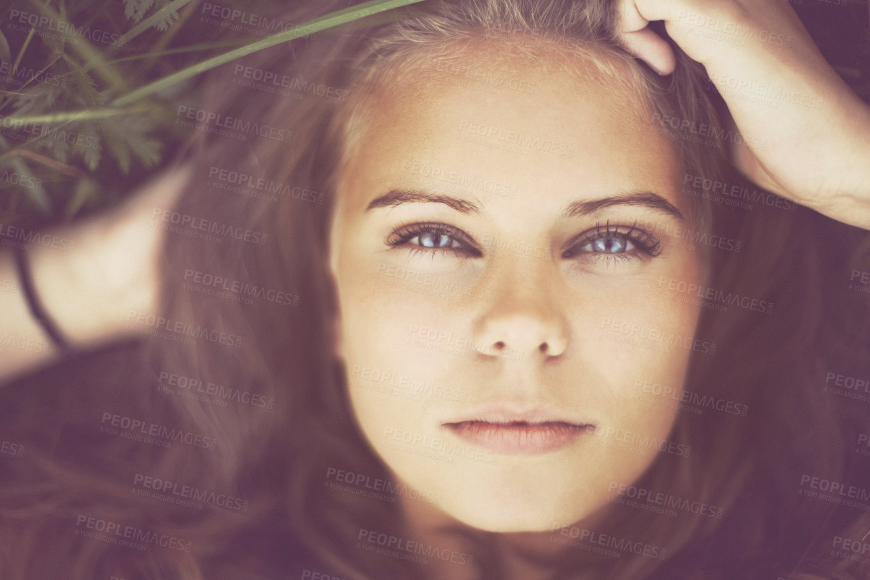 Buy stock photo Portrait, top view and beauty of woman on grass outdoor, healthy skin and freedom. Face, above and young person in nature, green garden and serious attractive girl relax in summer in Switzerland.