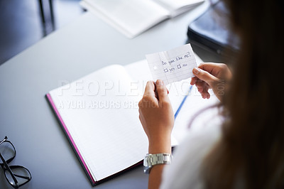 Buy stock photo Secret, note and student with love letter in class at high school with girl and social communication. Hand, paper and teenager with checklist, information or romantic question in classroom from crush
