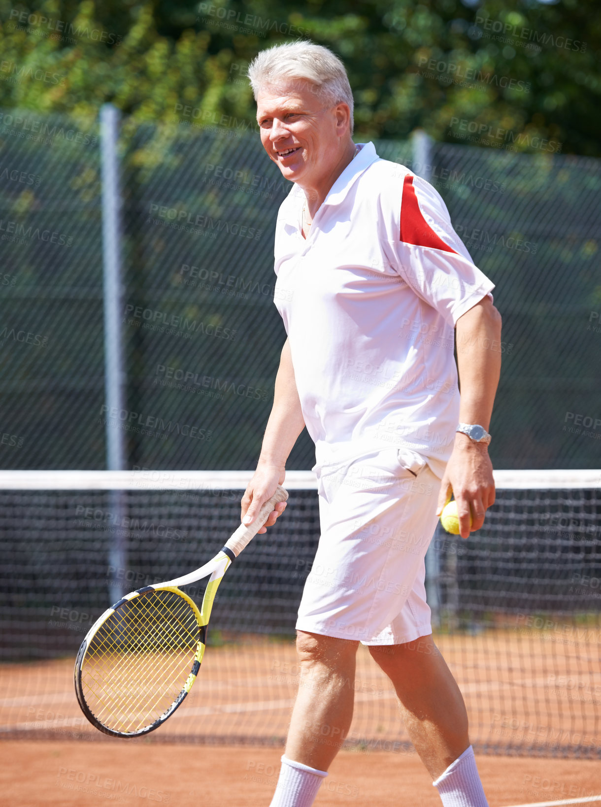 Buy stock photo Tennis, sports and senior man on court for playing game, match and practice for competition. Retirement, happy and elderly person with racket and ball for training, exercise and workout for hobby