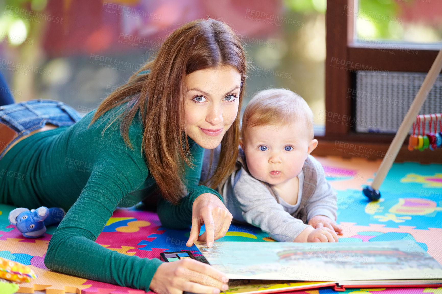 Buy stock photo Portrait, woman and baby with book in home for learning, development or cognitive growth for education. Mother, son or family with reading, bond and lying on floor in living room with toys for future