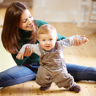 Buy stock photo Mother, baby and smile for help with standing for development, motor skills or walking with assistance. Boy, infant or toddler with excited expression on face for future growth, milestone and support
