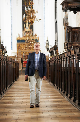 Buy stock photo Walking, aisle and elderly man in a church for sightseeing on a weekend trip, vacation or holiday. Grace, religion and holy senior male person in retirement in a worship cathedral in the city.