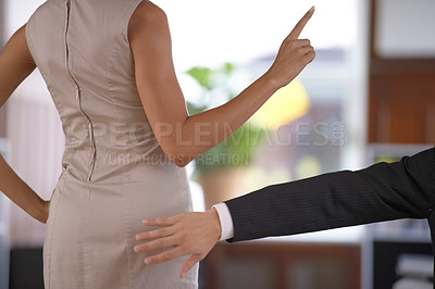 Buy stock photo Hand, butt and sexual harassment with a business person slapping the behind of a woman coworker in the office. Ethics, behaviour or no with an employee reaching to smack the bottom of a colleague