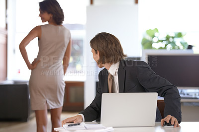 Buy stock photo Ethics, sexual harassment and a business man in the office with a woman colleague. Fantasy, cheating or affair with a male employee looking at the back of a coworker in the corporate workplace