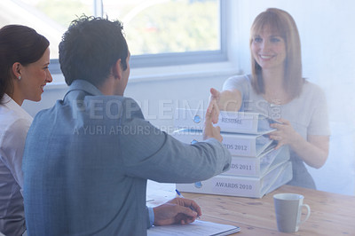 Buy stock photo Woman, employer and handshake in interview for welcome, onboarding and hiring in office or workplace. Business, professional and people with documents, paperwork or shaking hands in meeting or smile