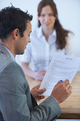 Buy stock photo Business man, job interview and resume, documents or CV for human resources, recruitment or hiring process. Professional people and employer reading application, employee review or paper in a meeting