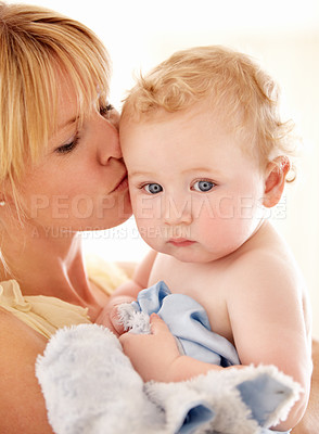 Buy stock photo Love, kiss and face of baby with mother in a house for bonding, playing or care, trust or growth. Family, support and  mom embrace boy kid in their home for child development, security or having fun