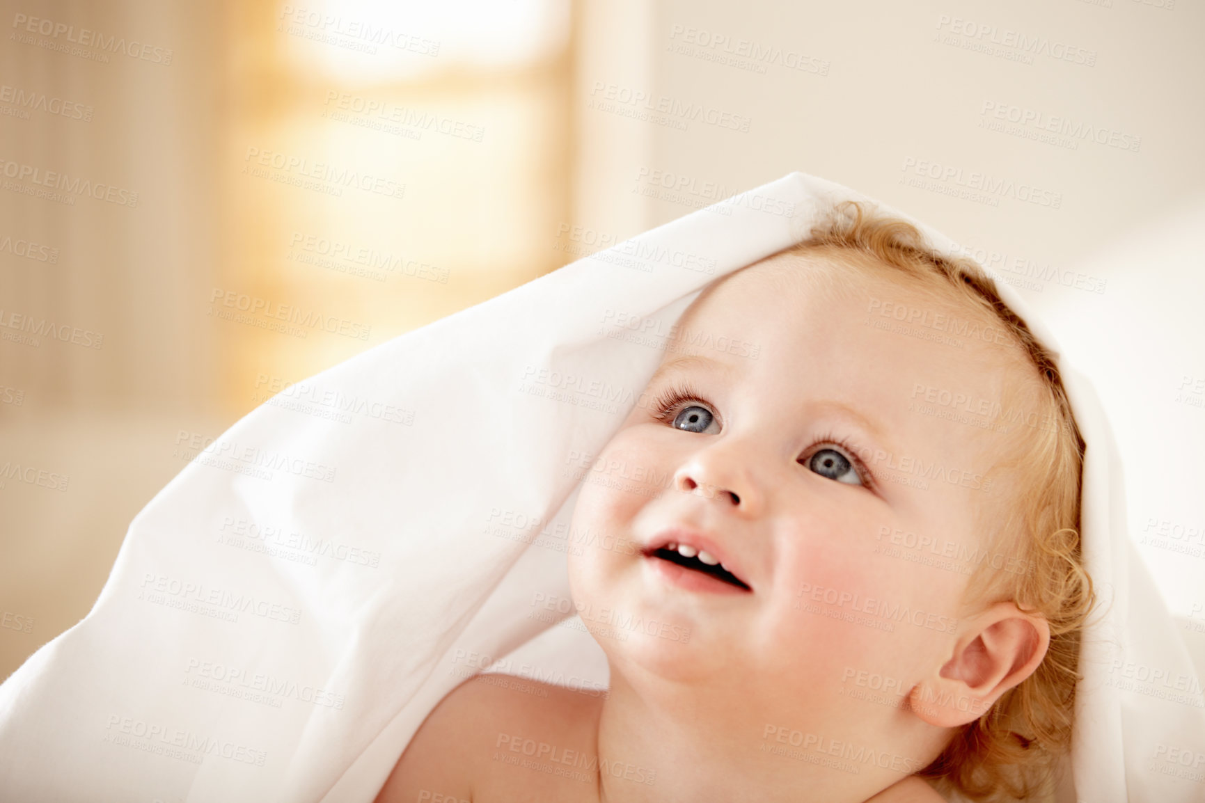 Buy stock photo Fascinated baby boy looking up at something