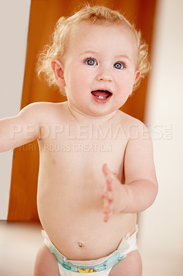 Buy stock photo Happy, face and baby in a house for playing, watching or fun, learning, walk or balance. Little, child development and curious boy kid in a nursery playful, standing and enjoy youth, freedom or games