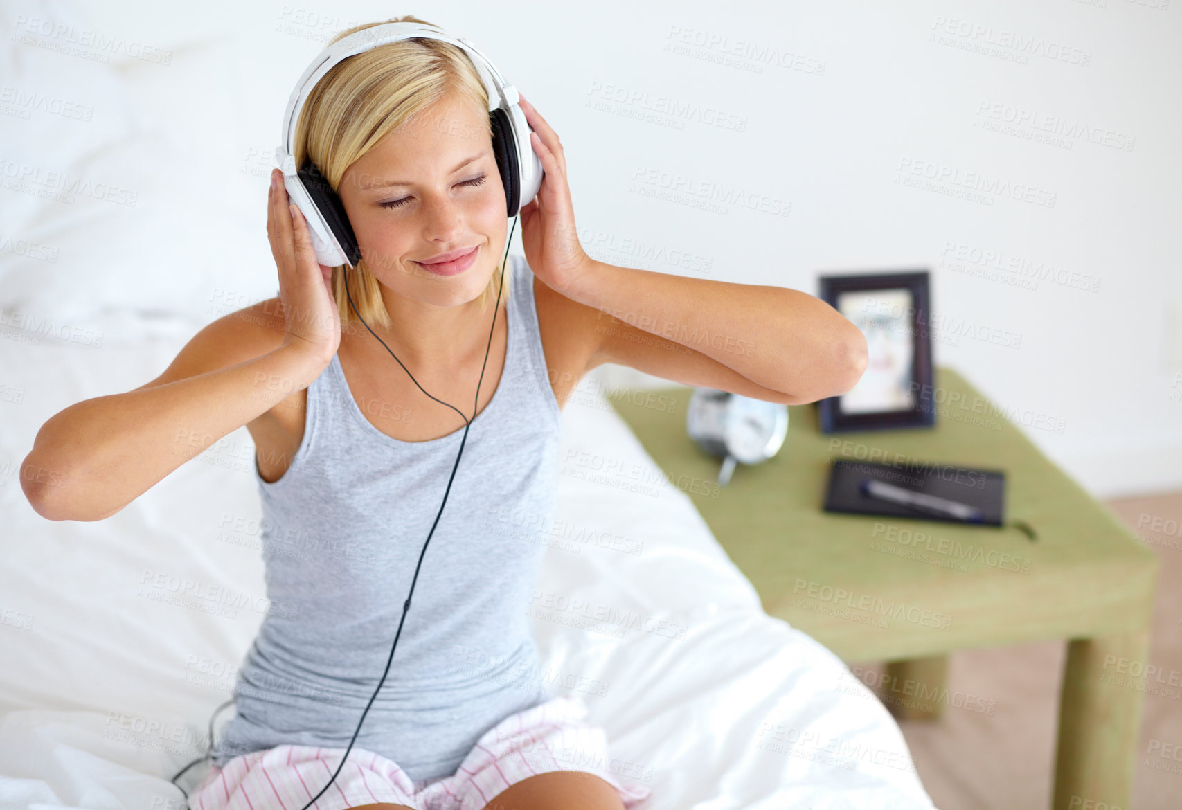 Buy stock photo Home, headphones and woman with music, bedroom and streaming sound with radio, peace and listening. Zen person, technology and girl with headset, podcast audio and playlist with connection and song