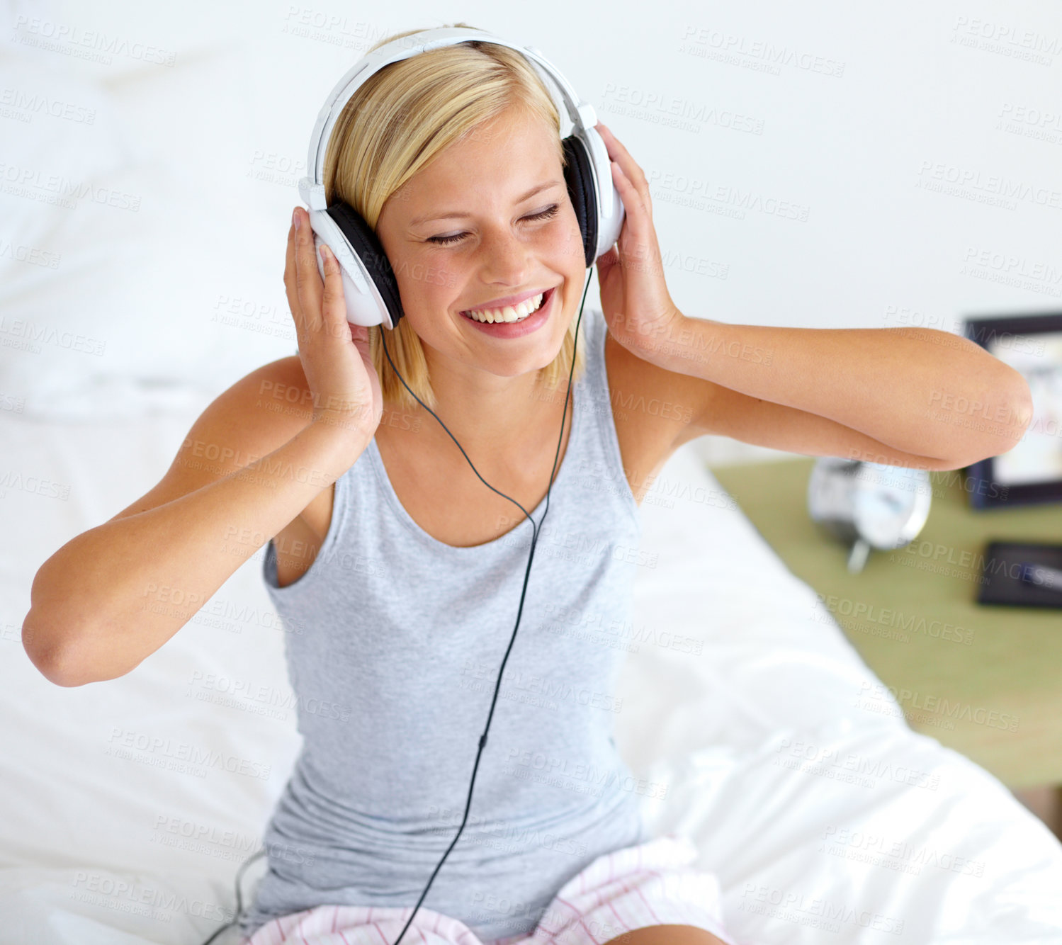 Buy stock photo Home, headphones and woman with music, smile and streaming sound with radio, peace and bed. Zen person, technology or girl with headset, podcast audio and playlist with connection, song or listening