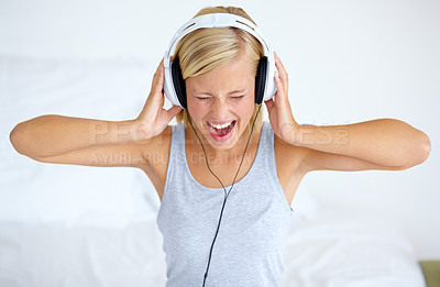 Buy stock photo Home, headphones and woman with streaming music, listening and song with radio, shout and loud. Person, technology or girl with headset, podcast audio and playlist with connection, sound or sing
