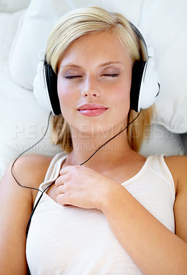 Buy stock photo Home, headphones and woman with music, streaming sound and listening with radio, peace or calm. Zen person, technology or girl with headset, podcast audio or playlist with connection, bedroom or song
