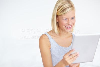 Buy stock photo Smile, happy and woman on tablet on a white background for social media, online shopping and internet. Relax, studio and isolated person on digital tech for reading website, news blog and research