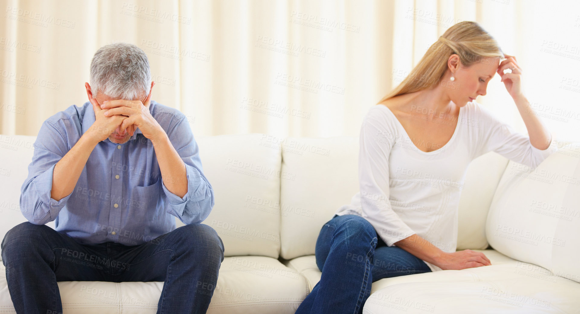 Buy stock photo Mature married couple sitting on the sofa and having a disagreement