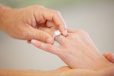 Buy stock photo People, hands and wedding ring for marriage, love or commitment together in promise at ceremony. Closeup of married groom putting diamond jewelry or accessory on bride for engagement, romance or care