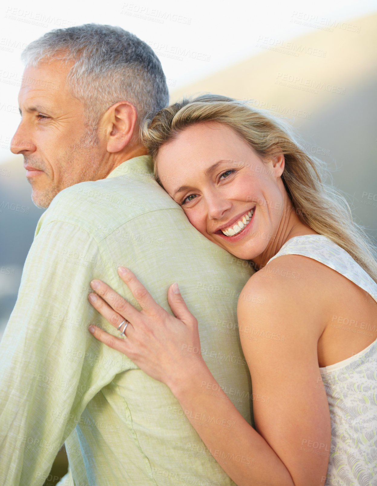 Buy stock photo Happy woman, portrait and hug man in marriage, love or embrace for honeymoon, romance or care together. Mature couple or female person hugging groom with smile outdoor in support, trust or commitment