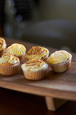 Buy stock photo Cupcake, dessert and bakery confectionery closeup, presentation and food with sweet baked goods. Luxury snack, frosting and sprinkles, hospitality and catering industry with cake on wooden table