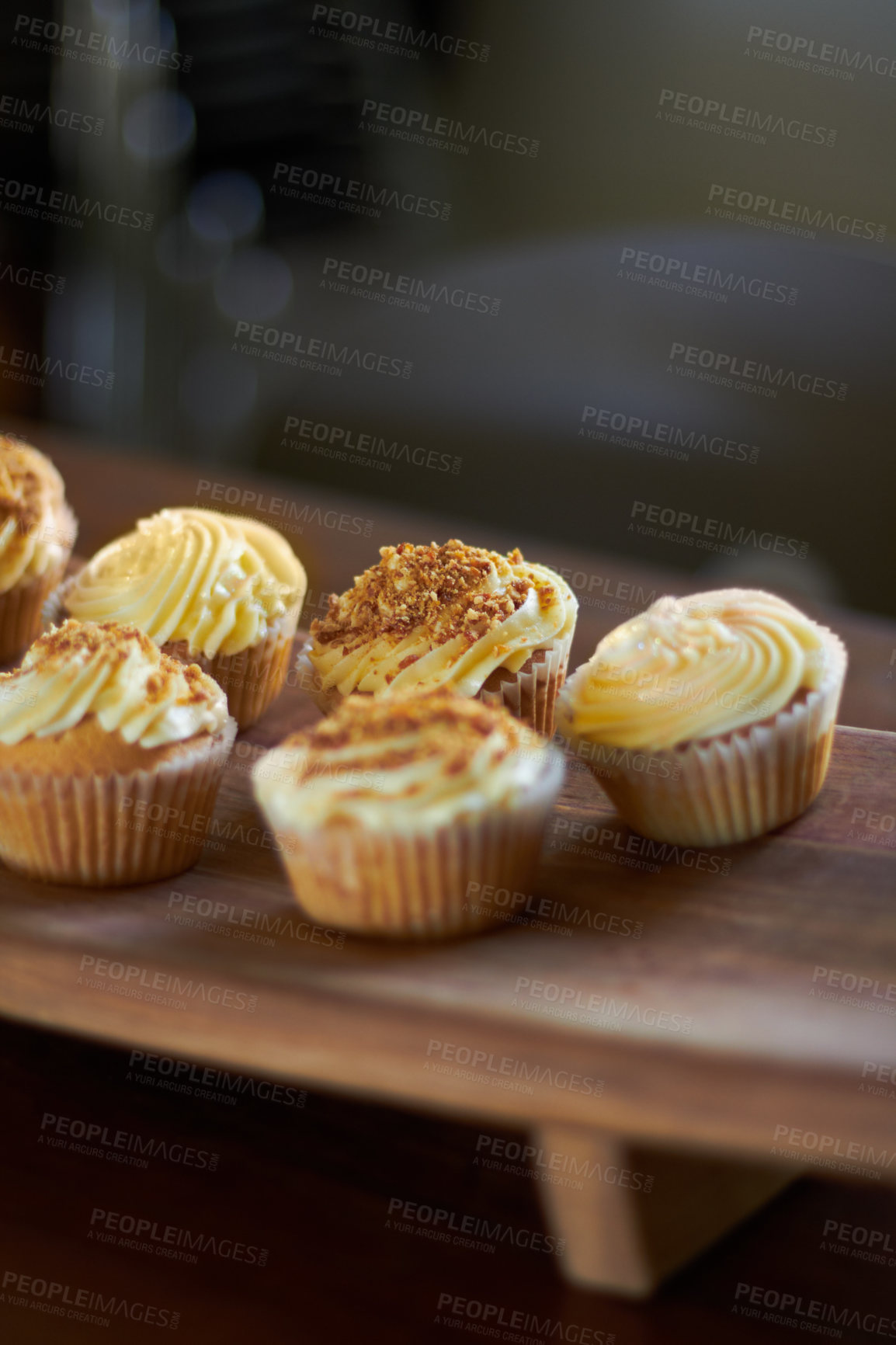 Buy stock photo Cupcake, dessert and bakery confectionery closeup, presentation and food with sweet baked goods. Luxury snack, frosting and sprinkles, hospitality and catering industry with cake on wooden table