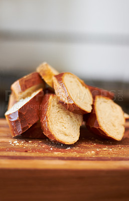 Buy stock photo Cooking, food and bakery with bread in kitchen for nutrition, health and diet. Breakfast, cafe and coffee shop with closeup of product on cutting board on table for wheat, grain and wellness