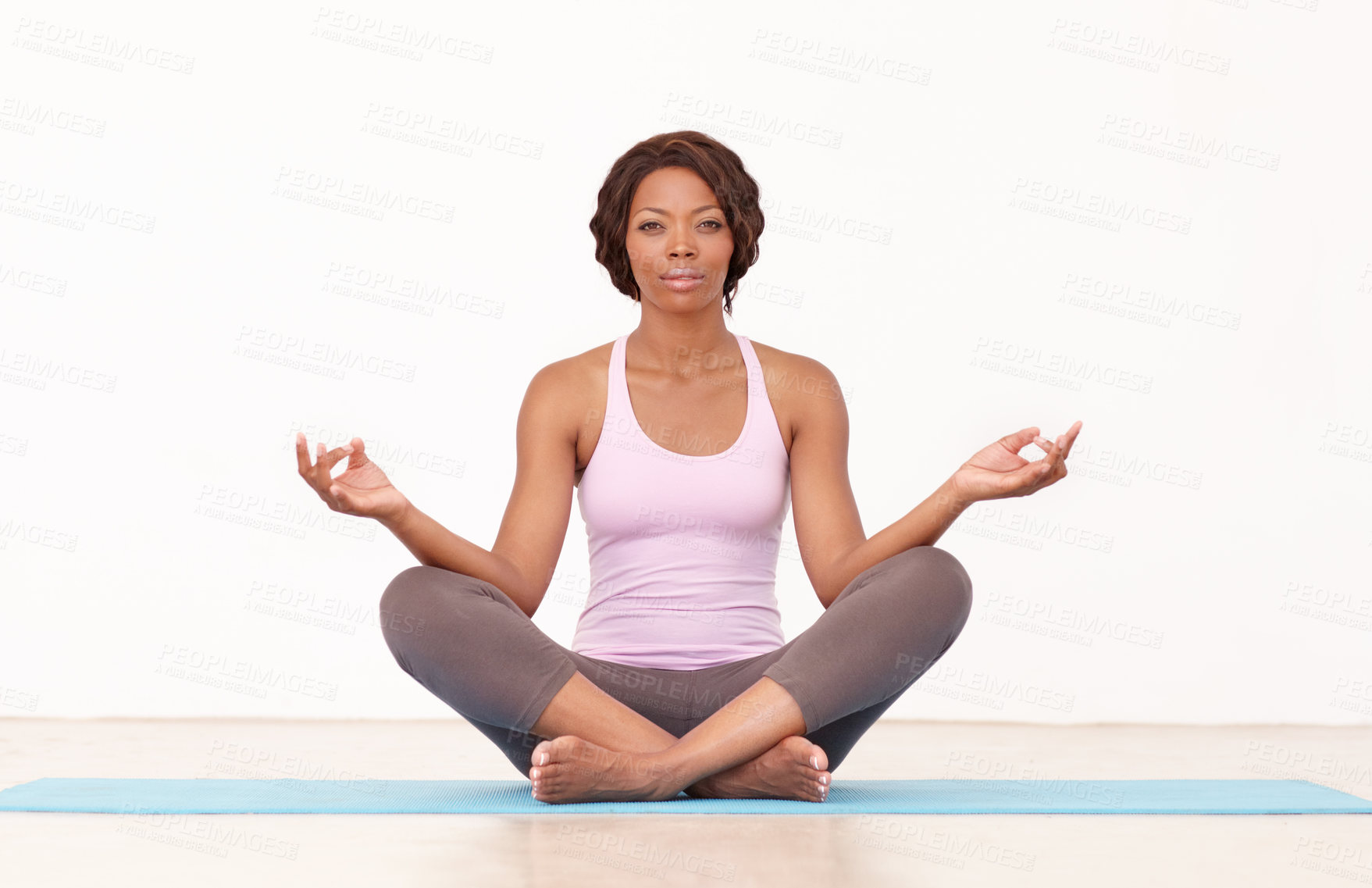 Buy stock photo Yoga, portrait and woman in lotus pose on studio floor for fitness, peace and wellness on white background. Face, exercise and African female with mockup for holistic workout, mental health and zen