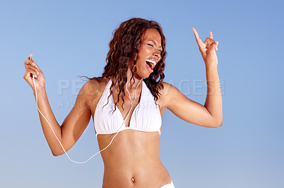 Buy stock photo Black woman, dancing and bikini with holiday and music from happy audio and headphones in studio. Smile, singing and travel with freedom and vacation of African female person with blue background