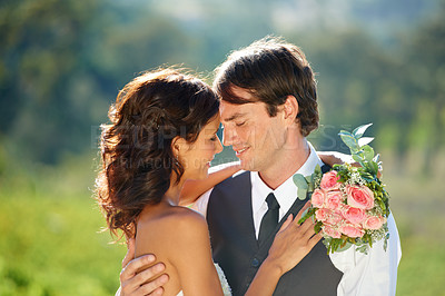 Buy stock photo Cropped view of a young bride and groom standing together