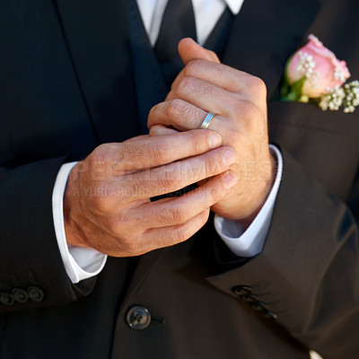 Buy stock photo Cropped image of a groom playing with his wedding ring